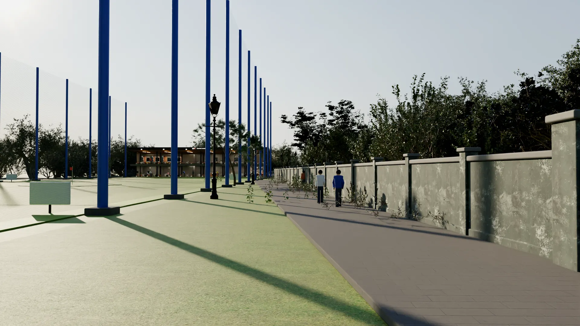 Just inside the gate: the pavement runs to the tee-box building, the range on the left behind blue net posts