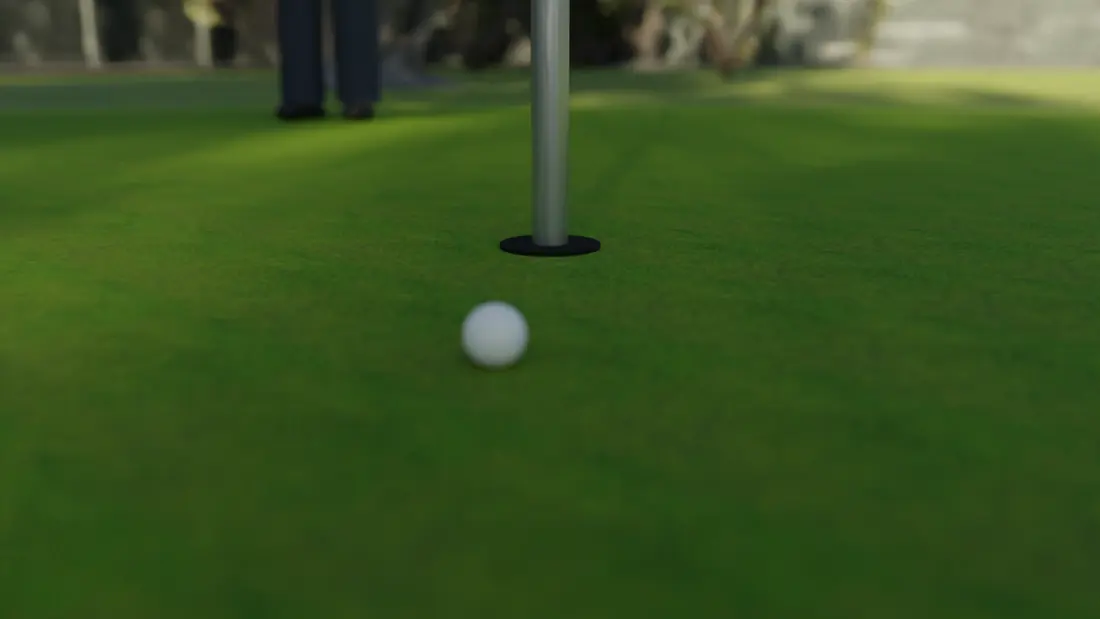 A ball two feet from the cup on the putting surface